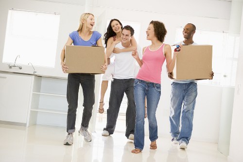 Professional movers loading boxes for a Greenwich home move