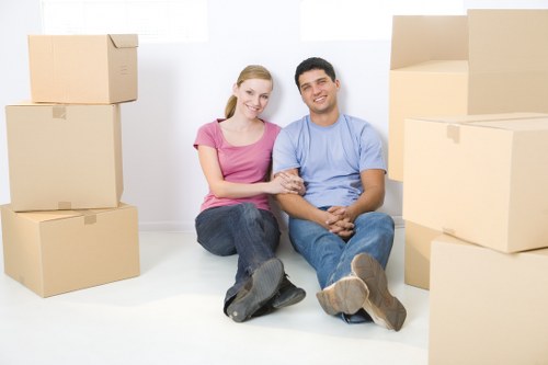 Same day removals team carrying household items