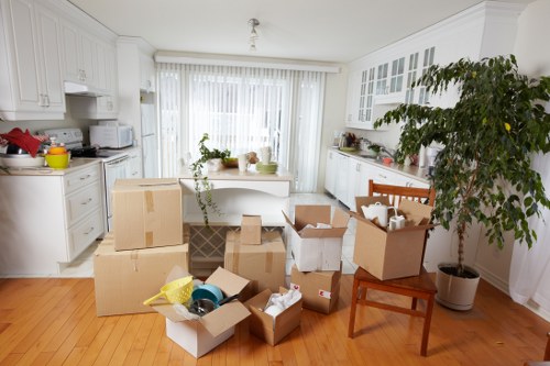 Packed boxes and furniture loaded into a Greenwich removal van