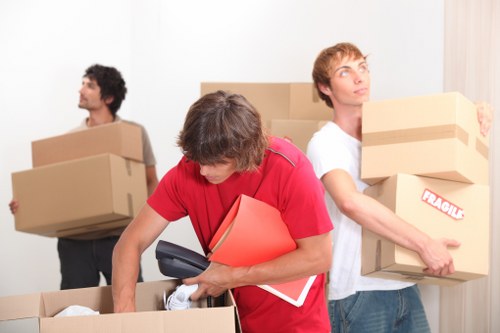 Team handling furniture in a Greenwich apartment building