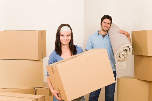 Professional movers handling office furniture during a Greenwich relocation