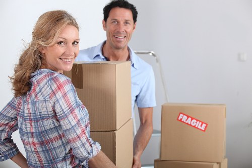 Local moving team loading furniture for a Greenwich removals job