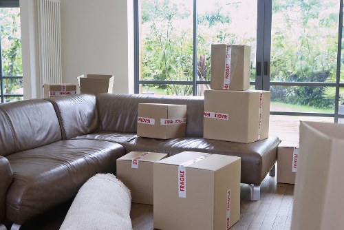 Local moving team handling boxes and furniture in Greenwich
