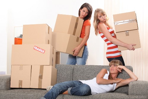 Professional movers transporting home furniture in Greenwich